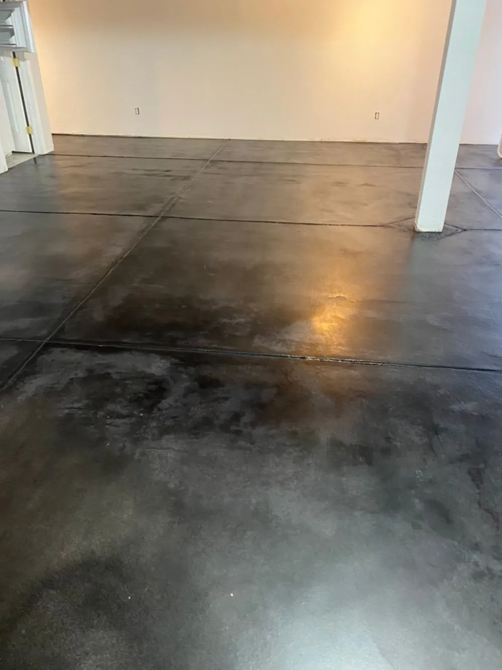 Polished commercial concrete floor with columns in a Denver-area building